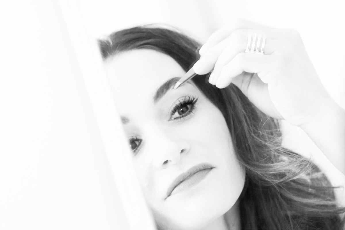 Black and white photo of a woman with a blurred background